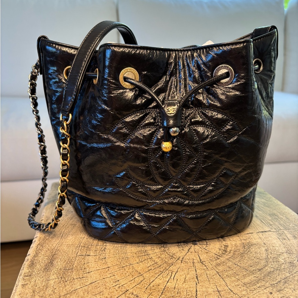 CHANEL Black Quilted Lambskin Drawstring Shoulder Bag with Gold Hardware